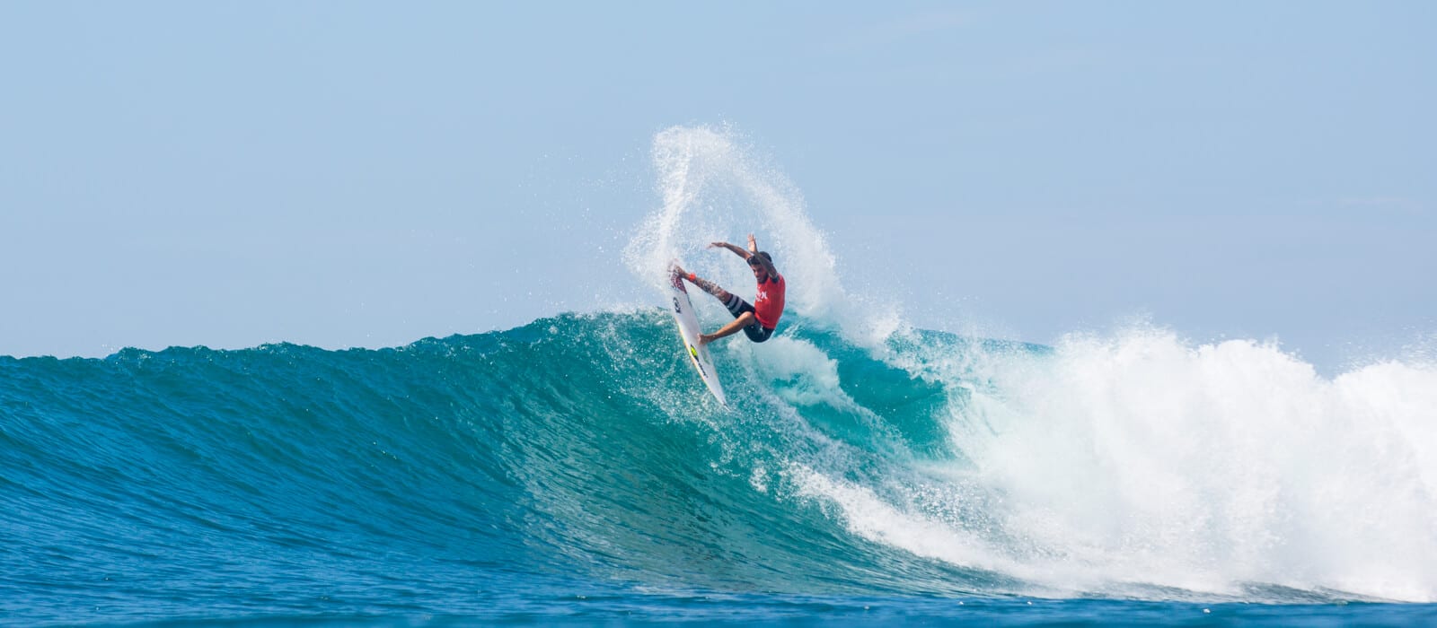 Filipe Toledo surfing massive tail slide
